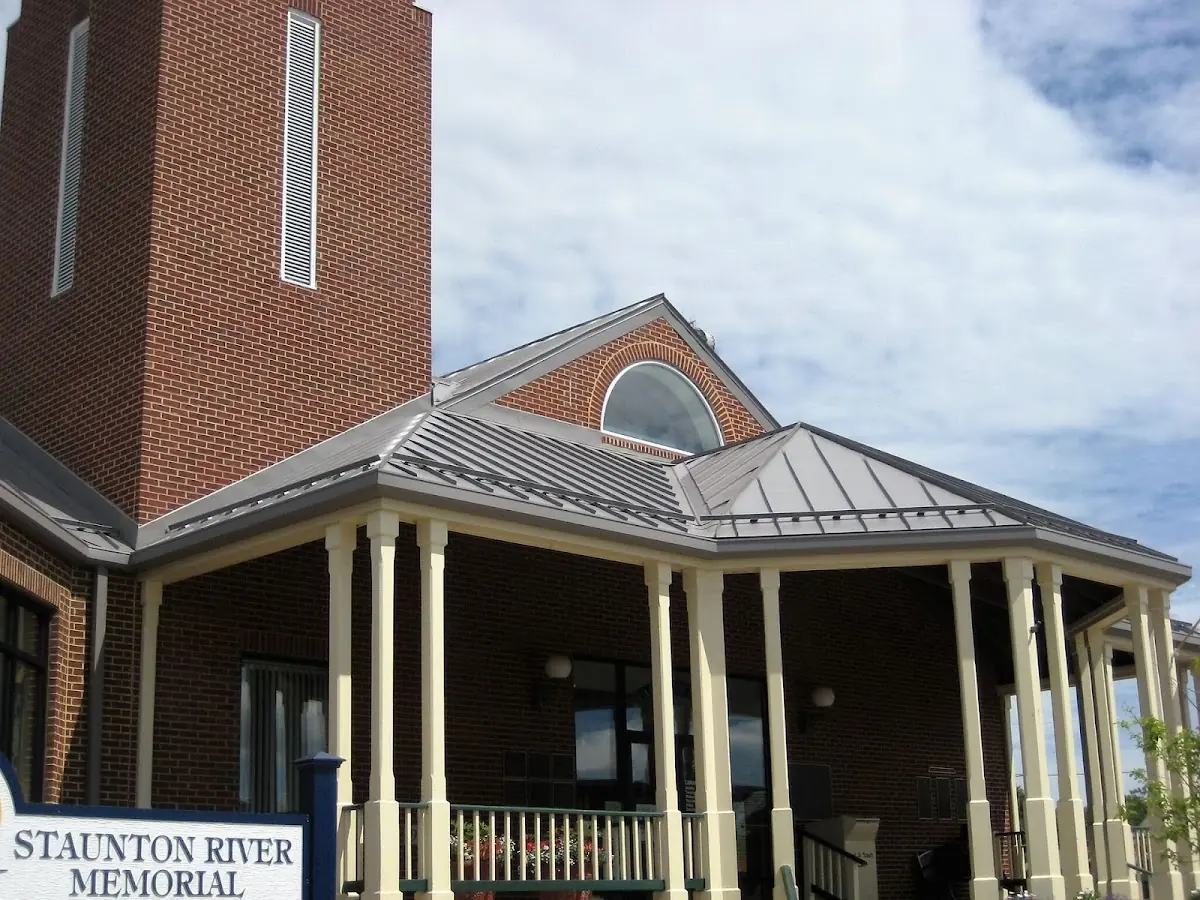 Skilled roofing craftsmen working on a residential roof in Oak Springs